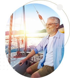 Older man on a yatch smiling into the distance at sunset_Fund Retirement Insert